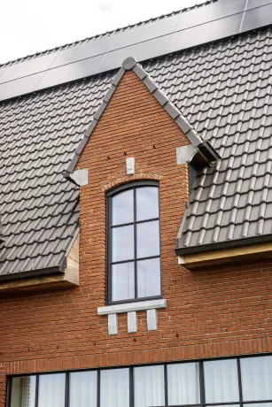 Dakrenovatie hellend dak met zink- en koperwerk
