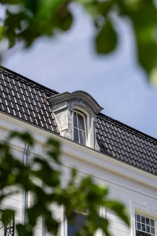 Dakrenovatie hellend/plat dak met zink- en koperwerk